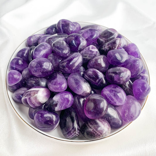 Amethyst Pocket Gems in a dish, promoting calm, protection, and spiritual growth for daily use.
