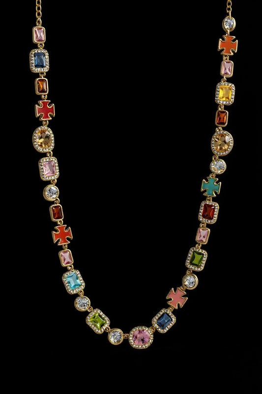 The Aurora Choker featuring multicolor gemstones set in gold, showcasing a vibrant array of colors reminiscent of a dawn-lit sky.