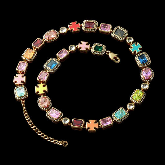 The Aurora Choker featuring multicolor faux gemstones in a gold frame, reflecting dawn-lit spectrum hues.