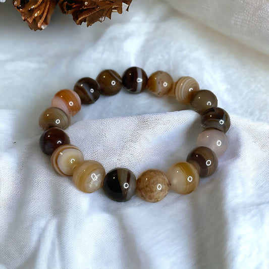 Desert Whisper Botswana Agate Bead Bracelet featuring polished, round beads in earthy tones of taupe, ivory, mocha, and blush.
