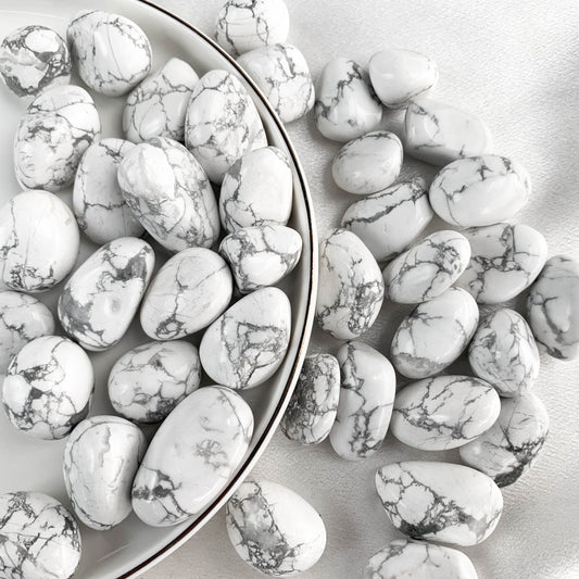 Assorted Howlite pocket gems in a bowl, known for their calming energy and emotional balance.