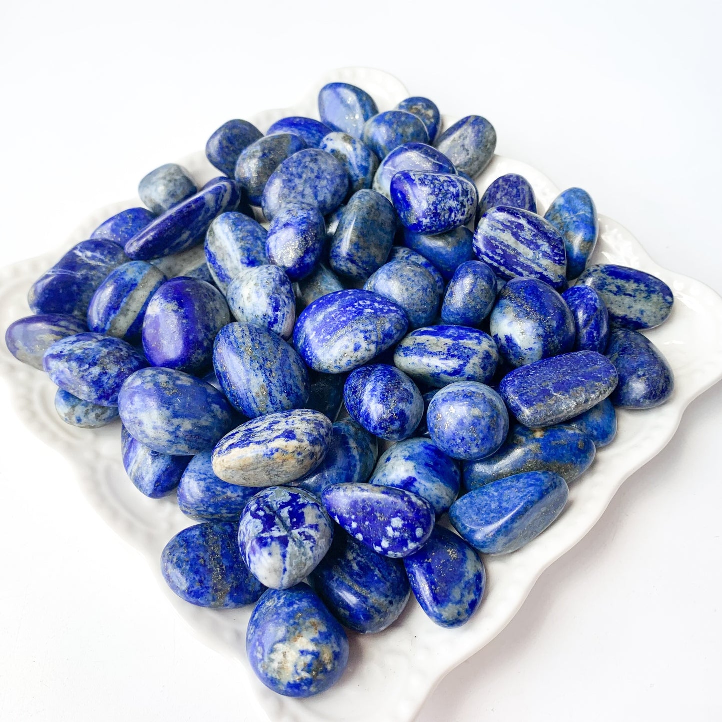 Collection of beautiful Lapis Lazuli pocket gems, promoting wisdom, protection, and inner strength.