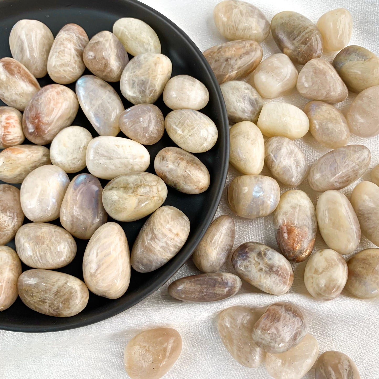 Peach Moonstone pocket gems in various shapes and sizes, symbolizing intuition and emotional balance.