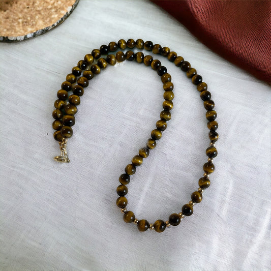 Handcrafted Golden Gaze Tiger’s Eye necklace featuring polished 6mm beads with shimmering golden bands.